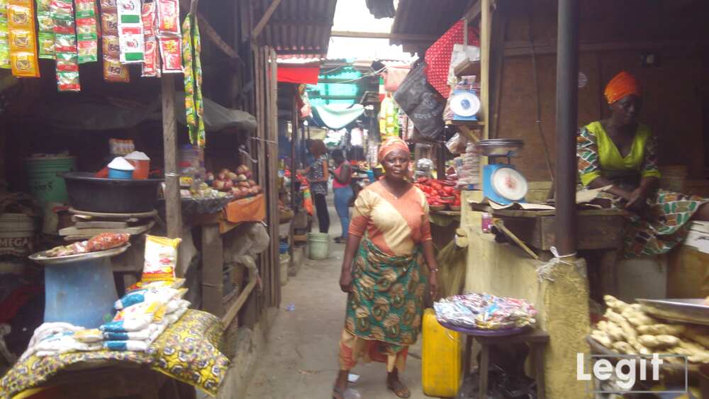 A trader sitting idle in the shop waiting patiently for buyers. Photo credit: Esther Odili