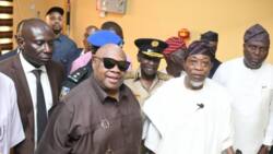 Davido's uncle Gov Adeleke prostrates in public to greet Aregbesola as Ilesha gets passport office