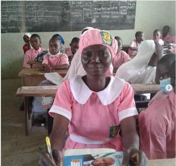 Joy as 50-year-old Nigerian woman starts secondary school, strikes a pose in secondary school