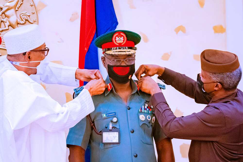 Buhari and Osinbajo decorating COAS Yahaya