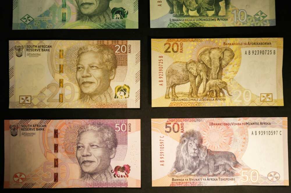 South Africa's central bank on May 4, 2023 rolled out upgraded bank notes retaining the image of global icon Nelson Mandela and the country's wildlife, featuring the animal's offspring as a new addition.
Coming in five different colours, the banknotes bearing the portrait of anti-apartheid hero Mandela are slightly brighter, almost resembling monopoly money. Newly upgraded South African Rand banknotes depicting former South African president Nelson Mandela are displayed at the Nelson Mandela Foundation in Johannesburg on May 4, 2023.