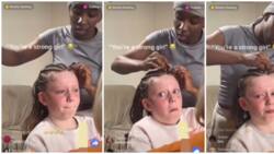 Viral video of little white girl holding back tears as she gets hair braided sparks reactions