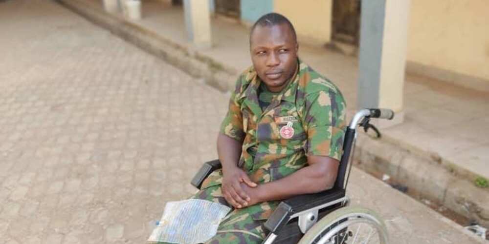 Wounded soldier using wheelchair begs Nigerians for help after suffering spinal cord injury