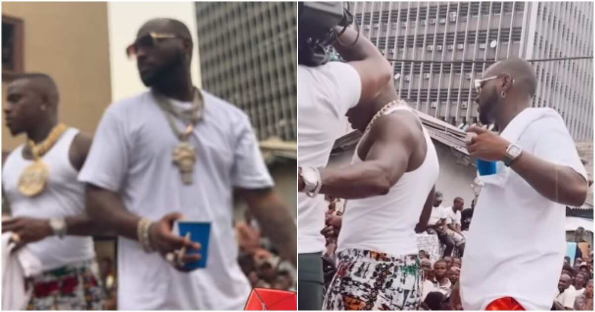 Davido takes US rapper DaBaby to Lagos trenches with huge crowd for their music video shoot, Nigerians react