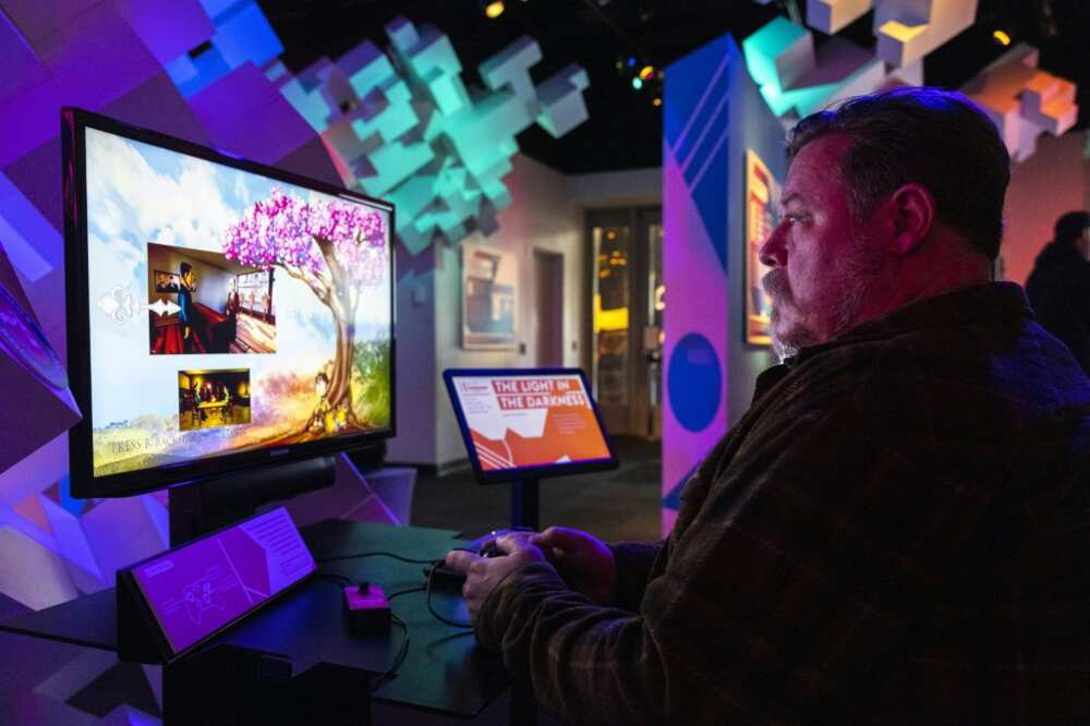 Gamer Stefan Montgomery plays 'The Light in the Darkness' at the Museum of Pop Culture in Seattle -- the game is available for play on computers, with console versions to follow soon