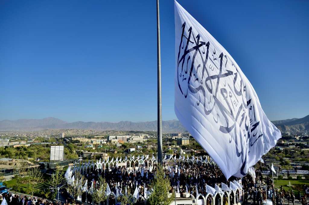 Taliban hoist giant flag in Afghan capital, eight months after return