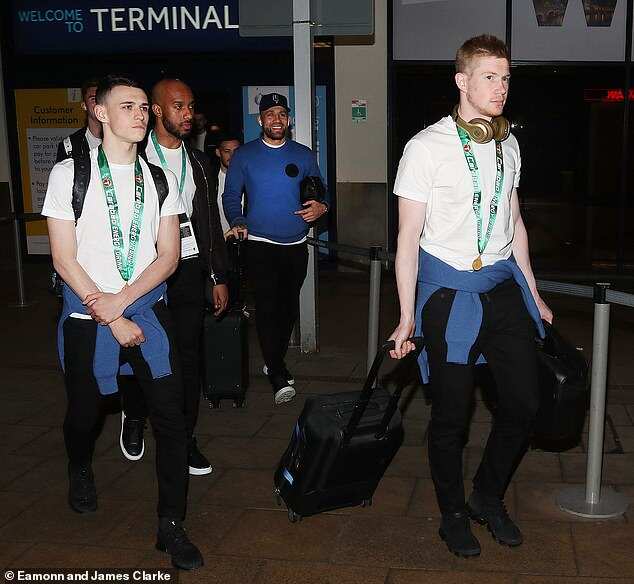 Man City stars arrive airport with Carabao Cup medals ...