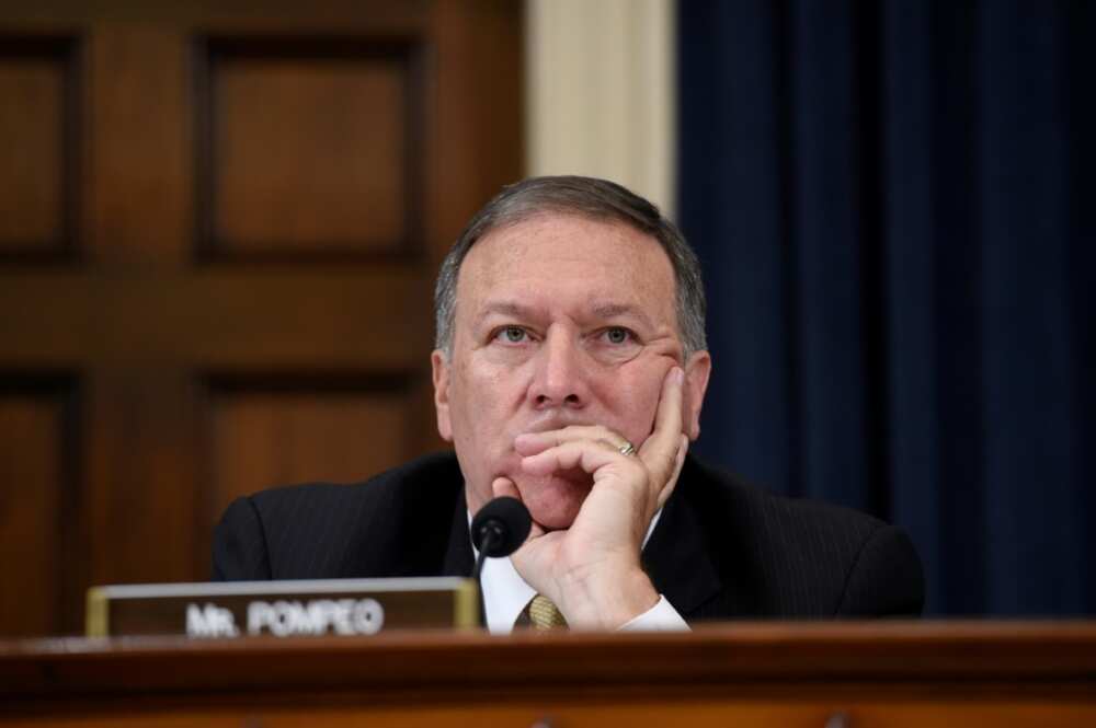 Mike Pompeo, then a Republican congressman, listens as former secretary of state Hillary Clinton addresses a committee in 2015 about the deadly attack on US diplomatic facilities in Benghazi, Libya