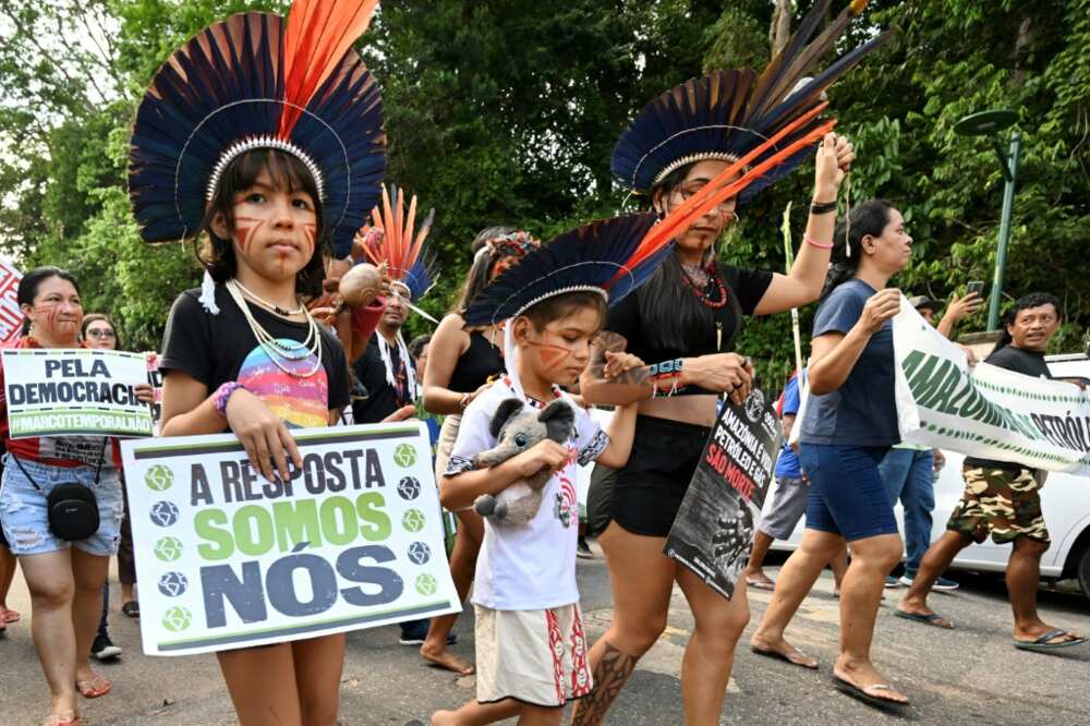 Amazon Indigenous activists and climate campaigners demonstrate on the sidelines of a summit in Belem, Brazil on saving the world's rainforests