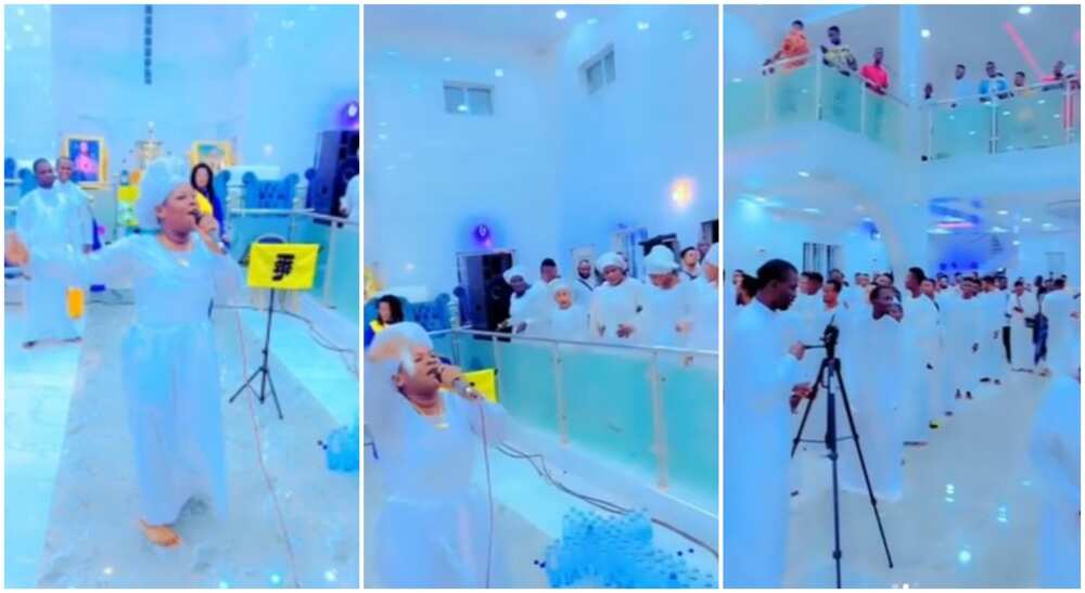 Nigerian church members in white garments sing and dance hard to "Zazu" during church service.