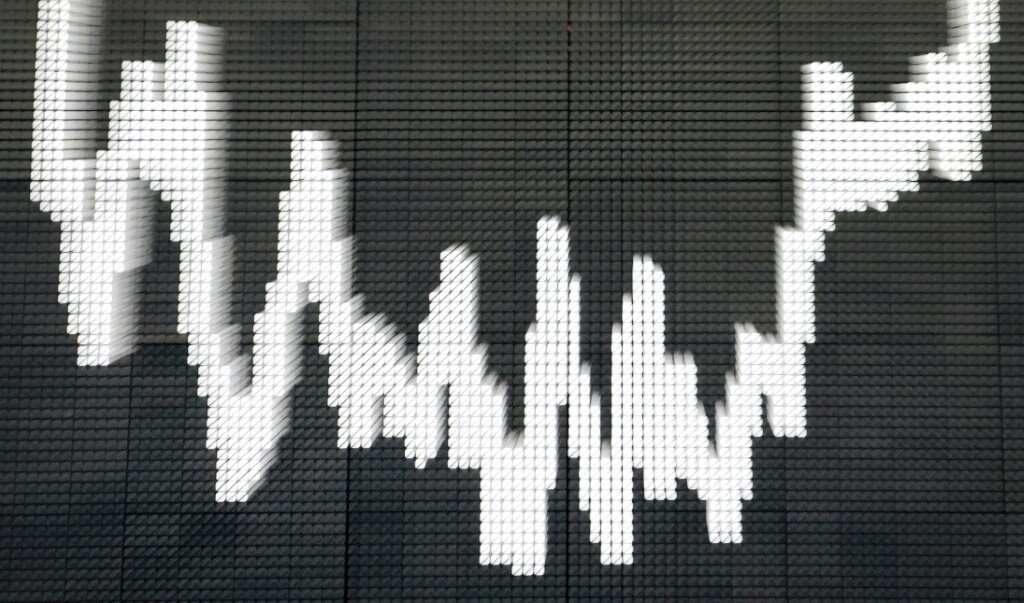 Markets mixed as traders weigh rates outlook