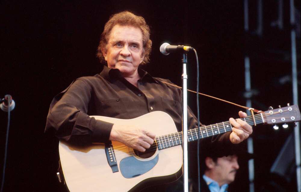 Johnny Cash performing at at Glastonbury Festival