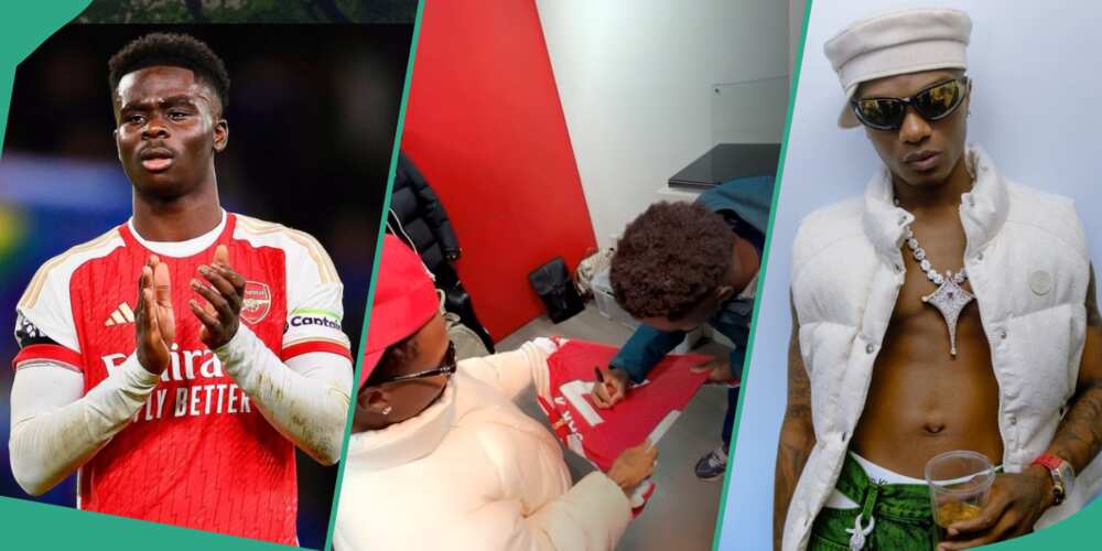Bukayo Saka signs Arsenal jersey for Wizkid