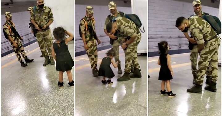 Salute, little girl salutes soldier, touch his feet