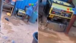 She is a good housewife: Nigerian lady uses soap & sponge to wash generator in Ibadan, video causes stir