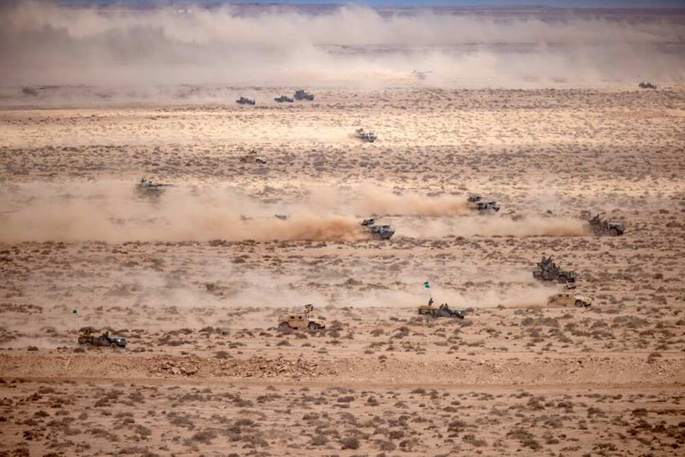 Troops simulated a joint land and air attack against enemy columns in a live fire exercise Troops simulated a joint land and air attack against enemy columns in a live fire exercise