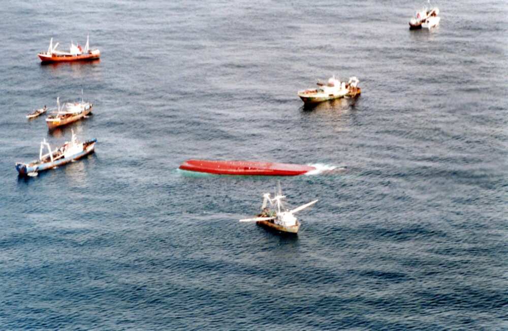 Fishing boats joined rescuers searching for survivors the day after the Senegalse capsized in 2002