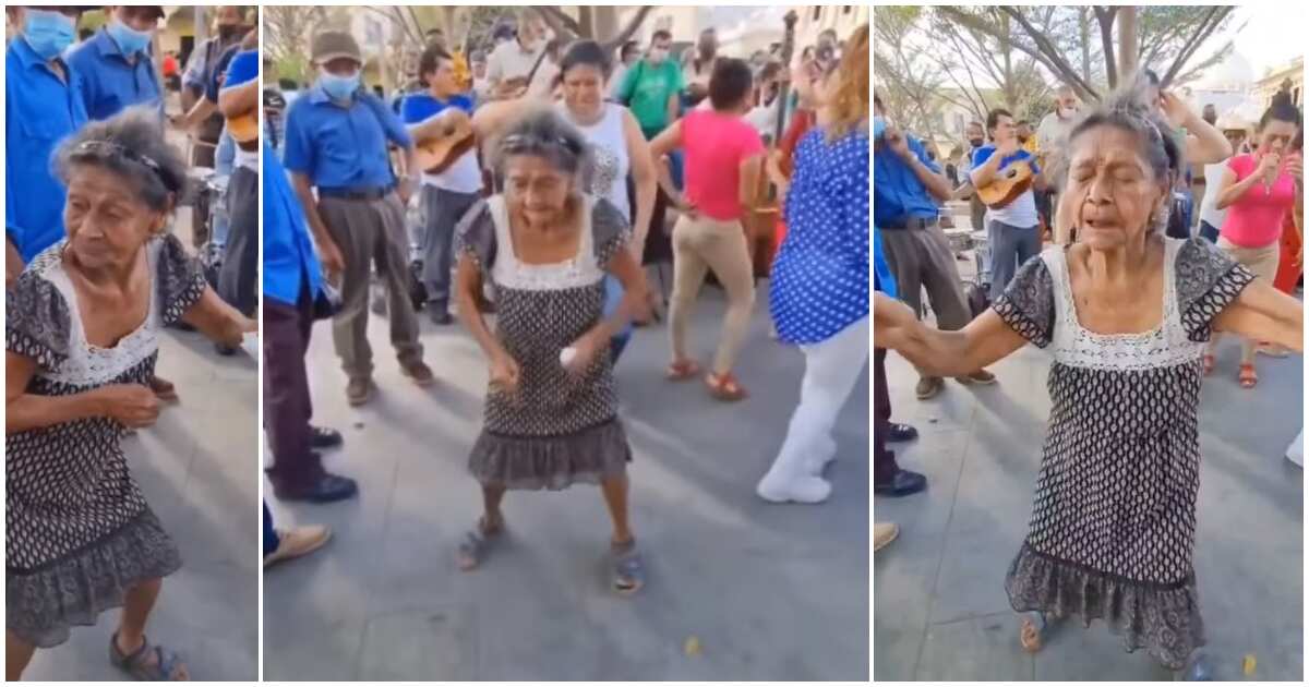 Old woman in sandals causes stir on street, shows off sweet leg dance moves and twerks on man in video