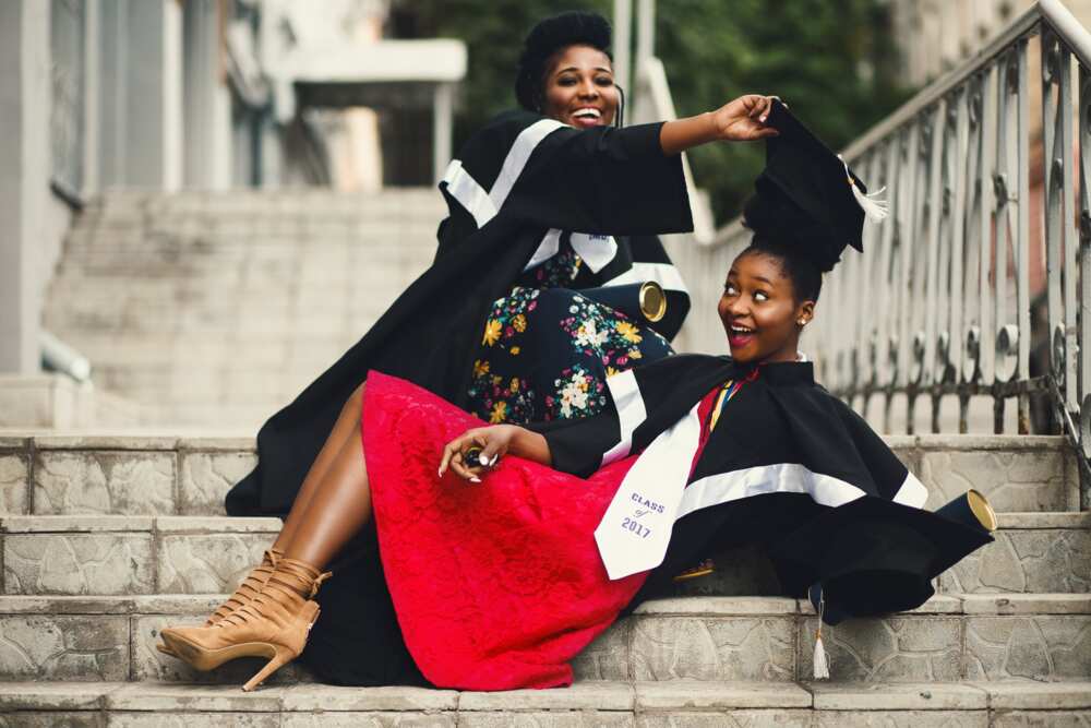 Students in academic dress on flight of stairs