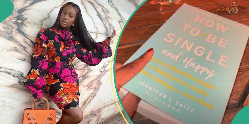 DJ Cuppy shows off the book she is reading.