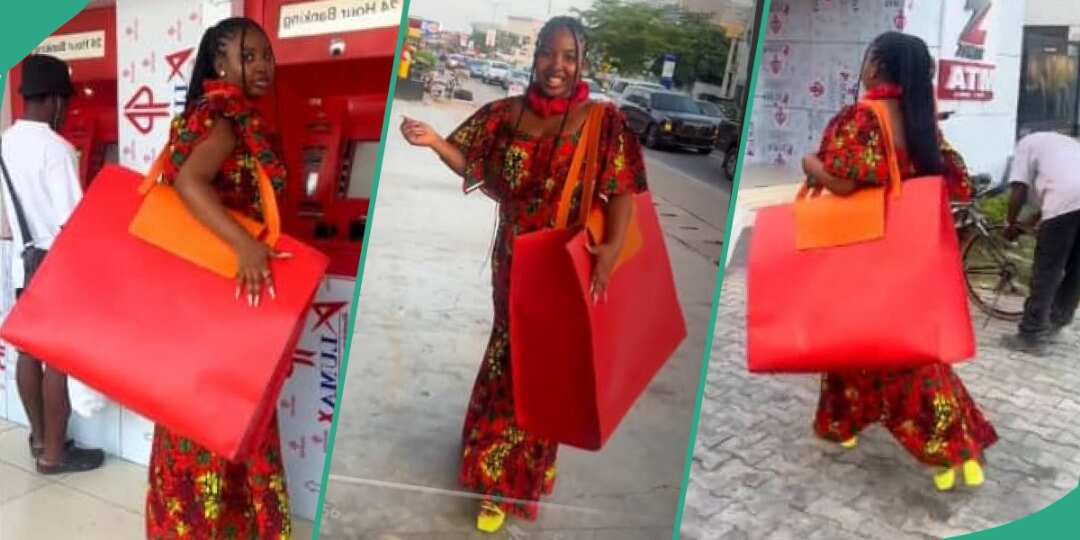 Watch video as Nigerian girl steps out into the streets with gigantic red bag