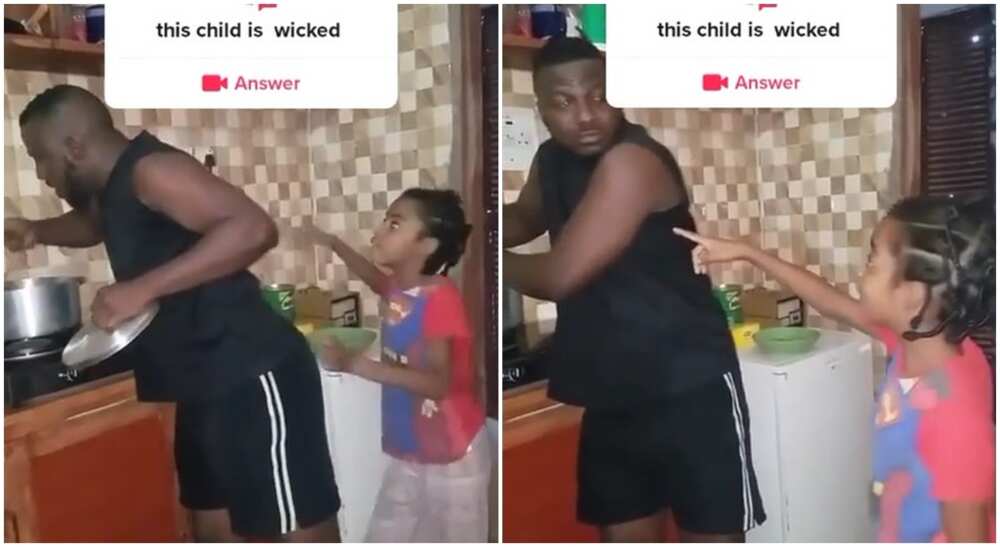 Photos of a funny girl scolding an adult after he stole meat from soup pot.