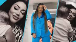 Nadia Buari's baby plays with her top as she sings to him in video, many gush over his straight hair