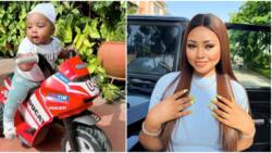 “He looks like a one-year-old”: Regina Daniels shares photos of her 2nd son on a bicycle as he clocks 4 months
