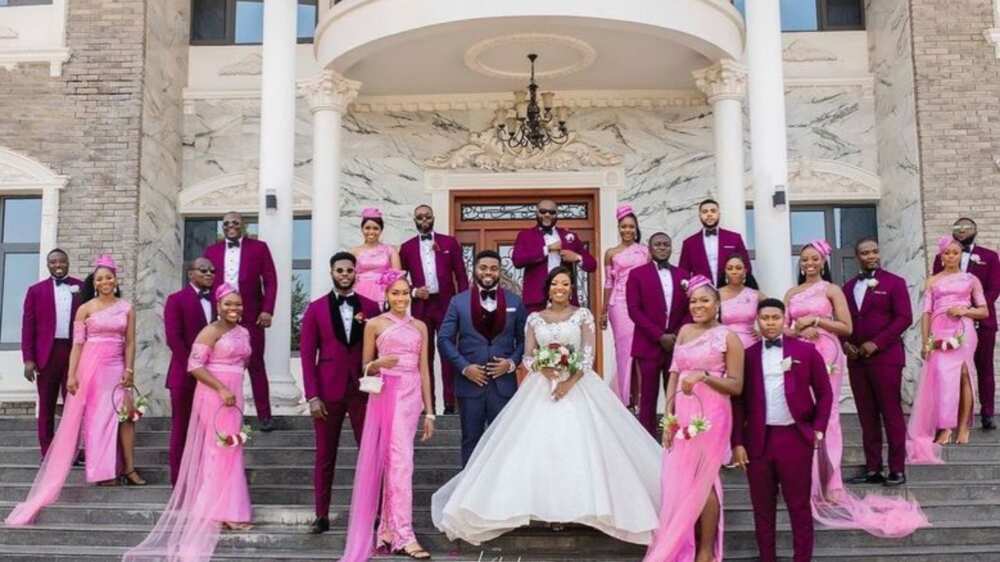 Adorable wedding photo lights up social media as couple and men in suits with bridal train showcase beauty