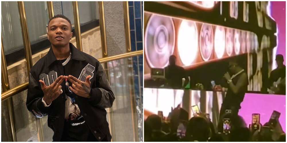 Wizkid collects phone from fan at concert