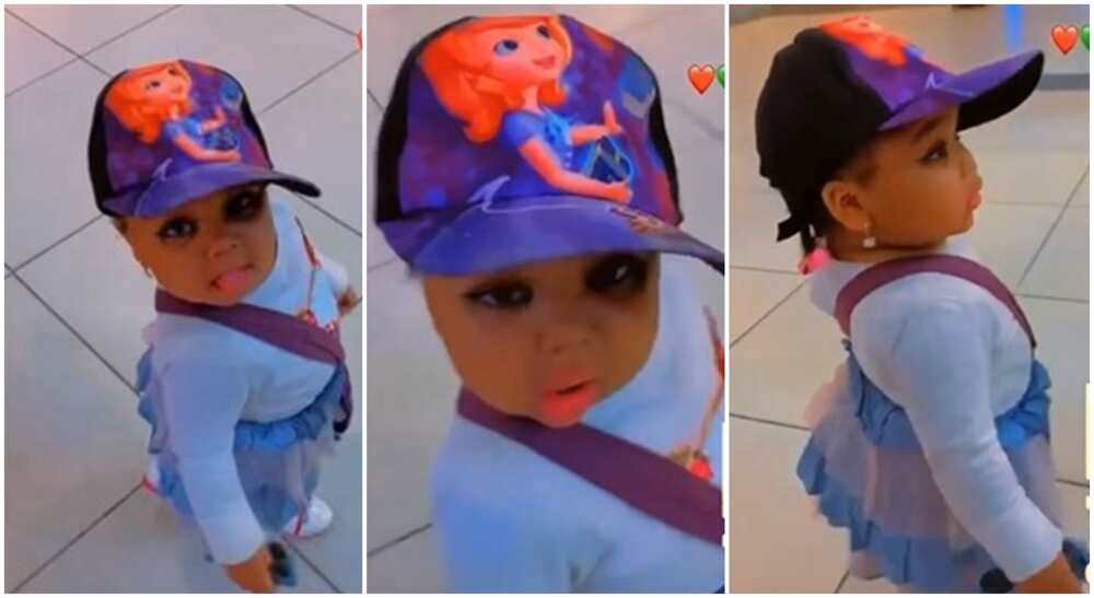 Little girl in fez cap