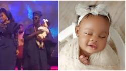 Comedian AY and wife Mabel rock matching outfits, dance to the altar during their baby dedication at church