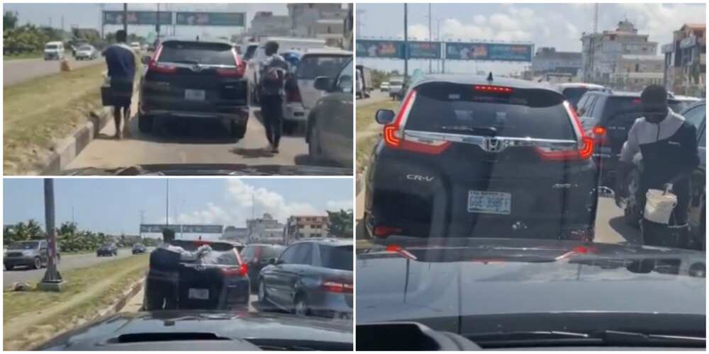 Wetin You no Go See for Lagos: Reactions as 'Hustler' Washes Moving Car on the Road, Video Goes Viral