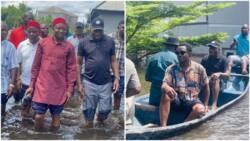 Viral photos show former President Jonathan riding in a canoe as he visits flood victims in Bayelsa