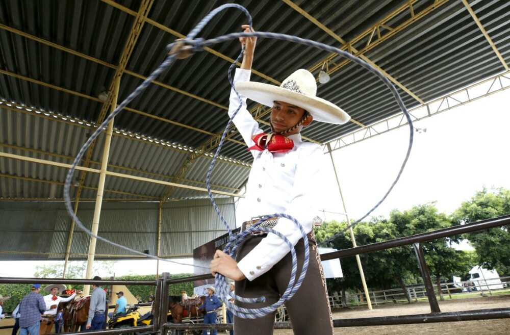 Victor Teran, 17, practices with a lasso at a "charreria" school in Mexico