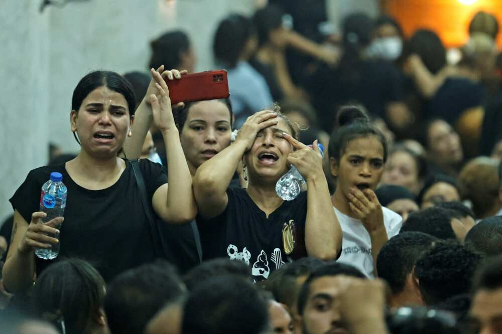 Mourners at the funeral of victims killed in Sunday's Coptic church fire in the Imbaba neighbourhood of greater Cairo