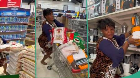 "Smart woman": Lady carries bags of rice, plenty food items during 30 seconds free shopping spree