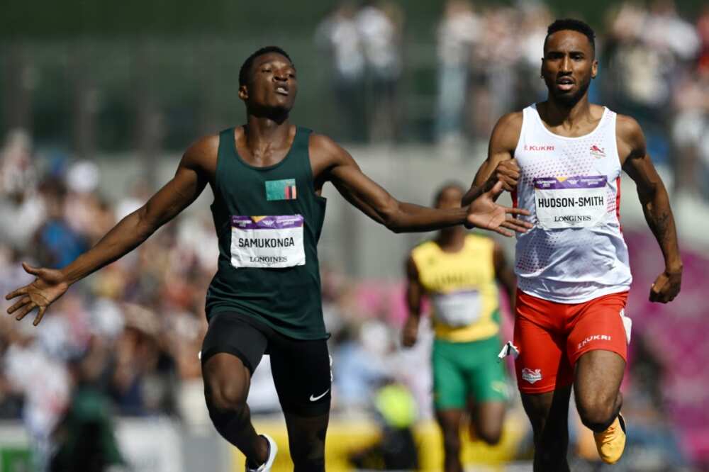 Zambia's Muzala Samukonga (L) comes home ahead of second-placed Matthew Hudson-Smith of England to take gold in the men's 400m final at the Commonwealth Games in Birmingham