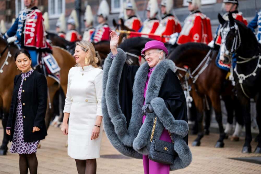 Queen Margrethe II waves to onlookers as she is welcomed by Copenhagen's Mayor Sophie Haestorp Andersen at city hall