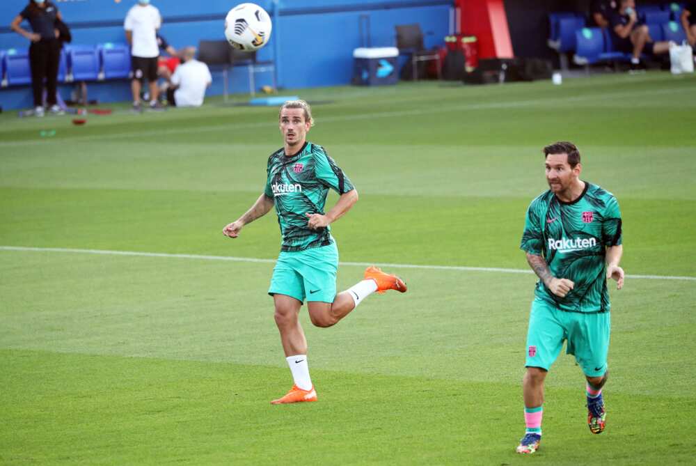 Antoine Griezmann and Messi in action for Barcelona