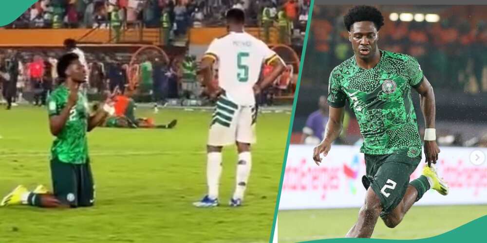 Ola Aina prays in front Cameroon player