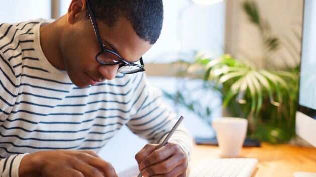 A man writing a letter