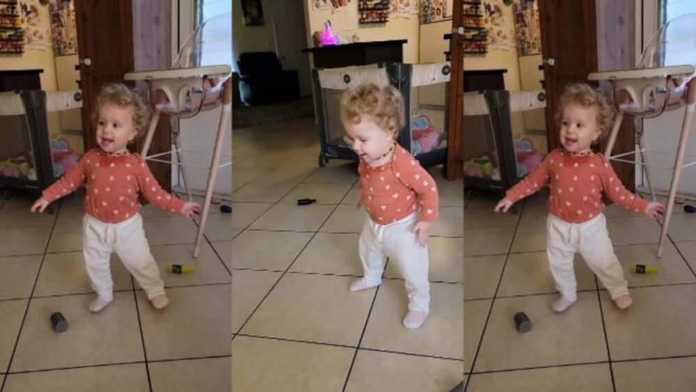 Mother captures moment of little girl dancing playfully Mother captures moment of little girl dancing playfully