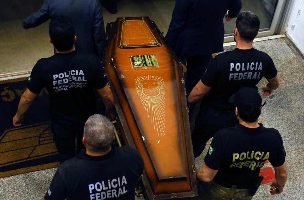 One of the coffins containing human remains found during the search for British journalist Dom Phillips and indigenous expert Bruno Pereira is carried upon arrival at the Federal Police hangar in Brasilia on June 16, 2022