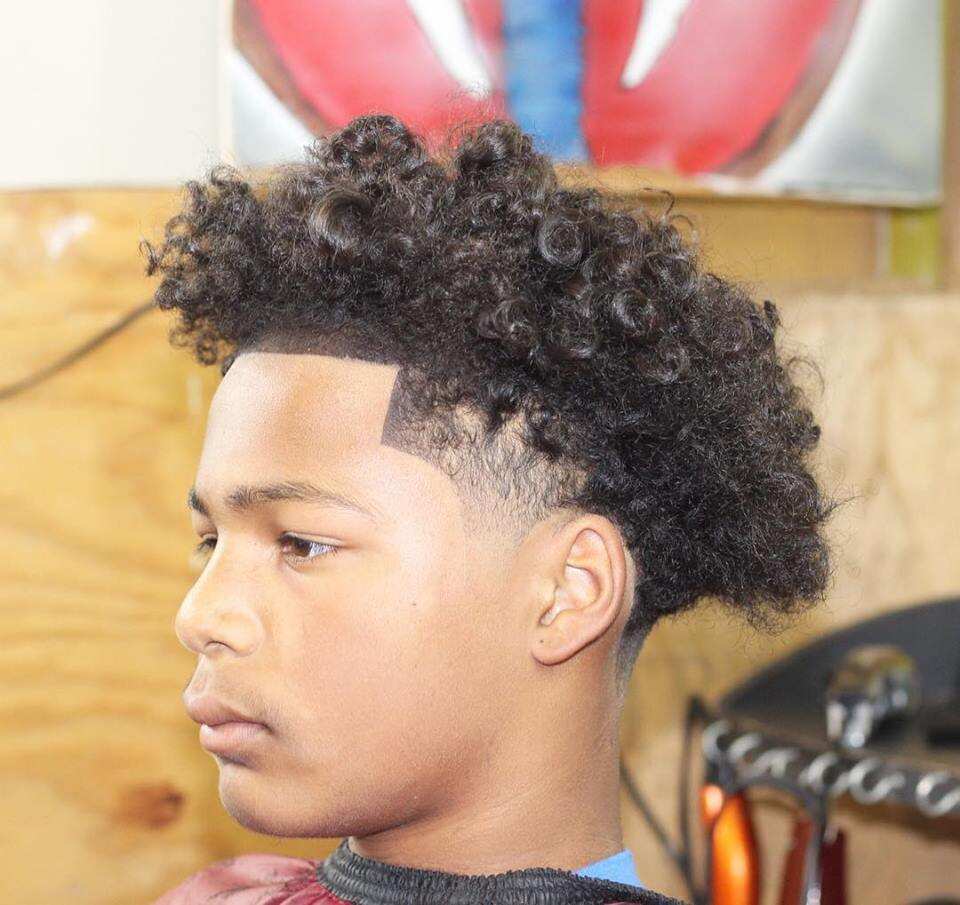 Low fade cut with curls