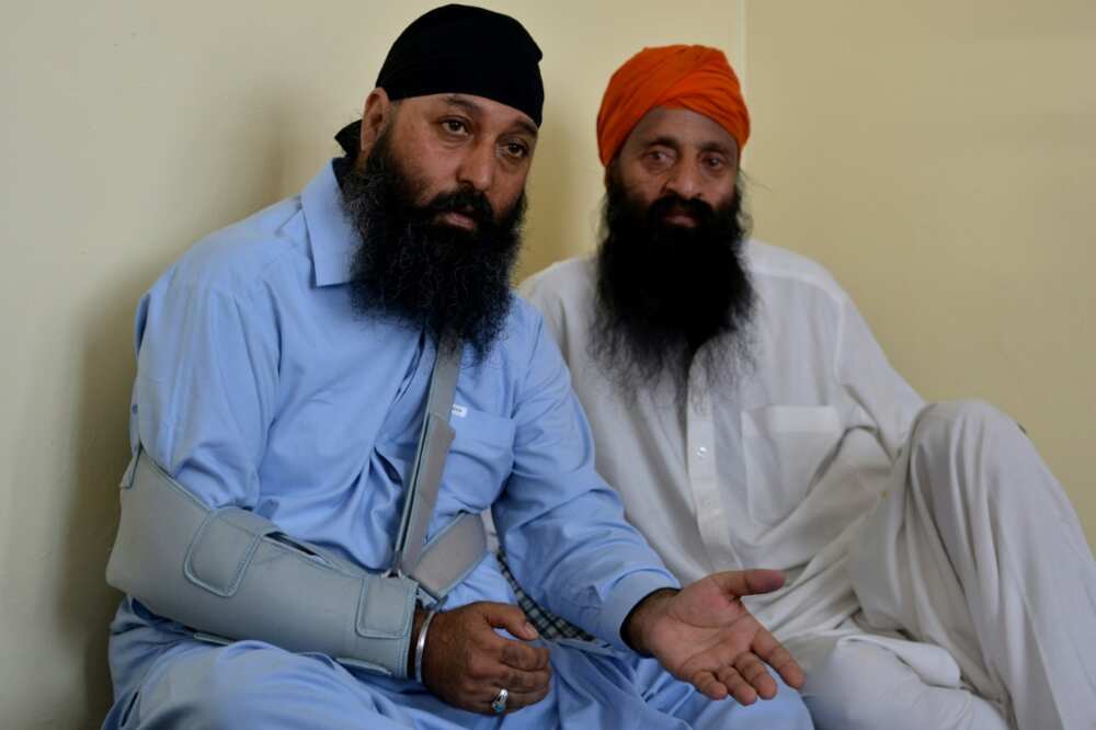 Ragbir Singh (left) was wounded when gunmen stormed the temple Saturday