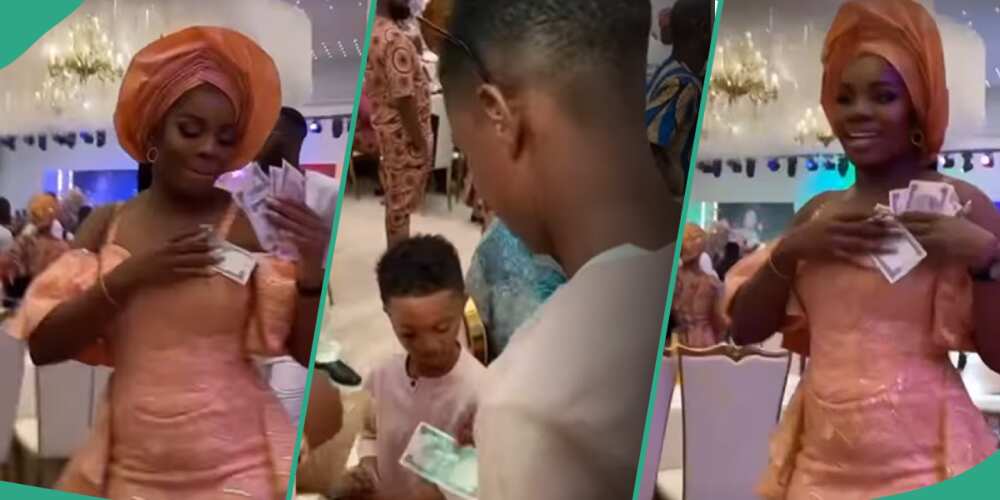 Wizkid's mum's burial party: Bolu sprays money on his mum and Zion.