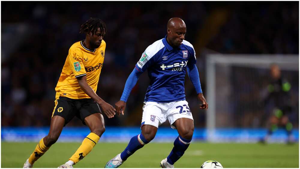 Sone Aluko playing for Ipswich Town against Wolves' Boubacar Traore in the Carabao Cup.