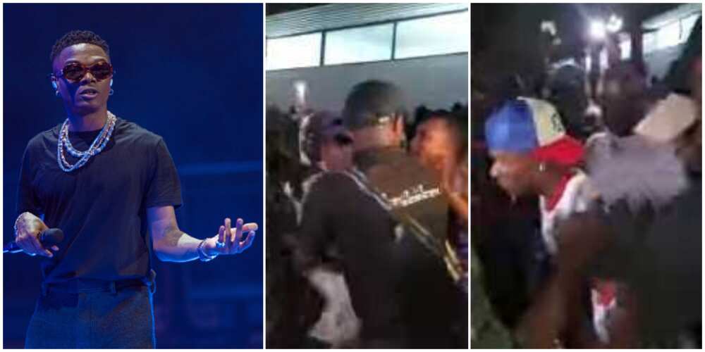 Viral video shows moment stubborn fan pulled Wizkid's shirt off and grabbed his glasses at Warri