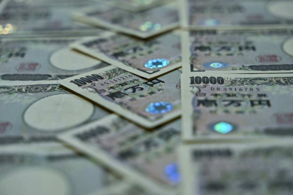 Analysts say the yen will continue to slide as long as the Bank of Japan's policies differ from the Federal Reserve's